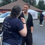 FTF Festival regular Erik Odom chats with a fan outside the Roundhouse last Friday morning.