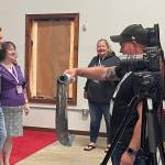 Peter Facinelli takes a photo with a fan during the photo-autograph session on Friday morning at the Kitla center. Facinelli portrayed Dr. Carlisle Cullen in the Twilight movie adaptations. FTF committee member Rob Hunter assists with a poster and Lissy Andros, Forks Chamber Executive Director and FTF Committee member looks on. Just outside the photo is actor Kellan Lutz, who portrayed Emmett Cullen in the Twilight Saga films.