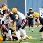 Photo by Lonnie Archibald
A host of Spartans trapped this Coyote runner, George Seubert, during this non-league contest held Saturday afternoon at Spartan Stadium. Forks players are Adon Arellano (63), Landon Thomas (77), Noah Foster (2), Brodie Fletcher (71), Pedro Francisco (28), and one unidentified player.