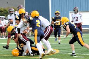Photo by Lonnie Archibald
A host of Spartans trapped this Coyote runner, George Seubert, during this non-league contest held Saturday afternoon at Spartan Stadium. Forks players are Adon Arellano (63), Landon Thomas (77), Noah Foster (2), Brodie Fletcher (71), Pedro Francisco (28), and one unidentified player.