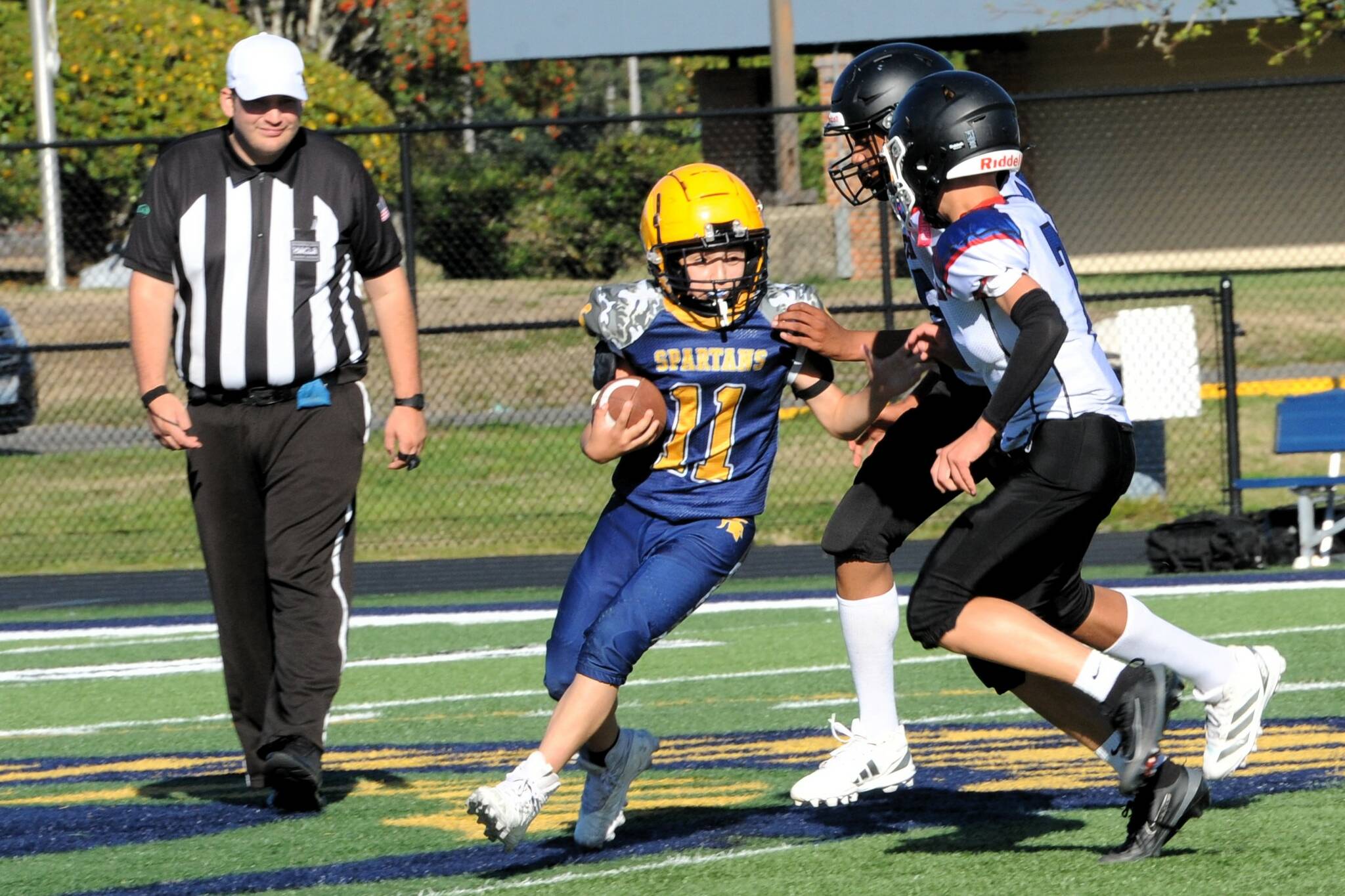 Photo by Lonnie Archibald
Spartan Xander Black makes a cut against Blue Heron. More football coverage on page 6.