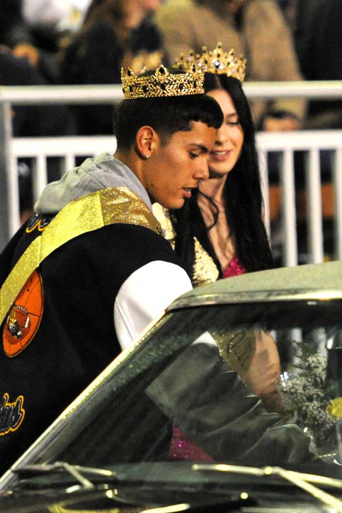 Noah Foster opens the door for Chloe Gaydeski as they were crowned Homecoming King and Queen Friday evening at Spartan Stadium.