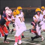 Spartan Kade Highfield runs behind the blocking of Cash Barajas (11) on the Turf of Spartan Stadium, Friday, Oct. 17, against the Trojans.