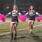 Forks cheerleaders lifted their voices on Friday evening for the Spartans  and for the fight against cancer.