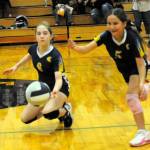 There was a lot of action in the Spartan Gym as Forks 7th and 8th graders and Chimicum displayed their skills in middle school volleyball. Pictured here, Spartans Nola McReynolds (6) and Jewel Salazar (5) go for the ball. 
Photo by Lonnie Archibald