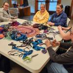 Photo Patsy Brown
Seven new rug makers left the Amish Knot Rag Rug class on Saturday with the start of a one-of-a-kind rug, diverting pounds of colorful strips of tired fast fashion from the landfill. This was part of the Rainforest Council for the Arts Autumn Arts Entertainment event. The class was led by Patsy Brown.