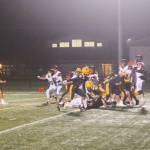 Photos by Lonnie Archibald
Napavine defenders leap high in the fog in an attempt to block a Forks field goal in the first quarter of play. Spartan kicker Mario Reyes kicked it through the uprights, however, giving the Spartans a three-point lead. The Tigers roared back, however, defeating Forks 20 to 15 in a hard-fought contest.