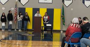 Photo Christi Baron
Forks Middle School students wait their turn to speak during the Veterans Assembly held Monday afternoon in the Forks High School gym. Forks Elementary students performed several songs, the school band played, and the Forks Community Orchestra shared a piece written in 1927 by James Egbert, the districts first superintendent and founder of Forks High School. Local veterans in attendance were recognized, and a slideshow honored their service.
