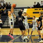 Spartan Kaden Woody rebounds against Stevens. Also in the action are Cam Campbell (4), Declan Weekes (3), Nolan Wilson (10), and Jaxon Koskela (2).
Photo by
Lonnie Archibald