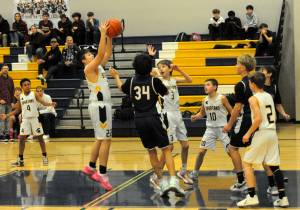 Spartan Kaden Woody rebounds against Stevens. Also in the action are Cam Campbell (4), Declan Weekes (3), Nolan Wilson (10), and Jaxon Koskela (2).
Photo by
Lonnie Archibald