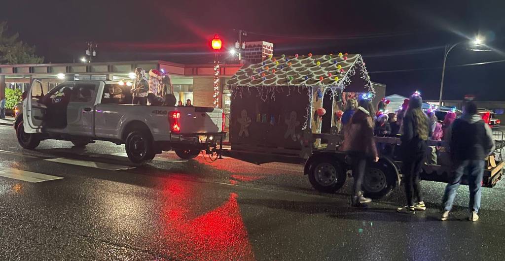 Photo Christi Baron
It was lights out during the parade Saturday night but never fear …Taylor Soha shared, Our lights on our gingerbread house went out right when the parade started. My husband hopped out of our truck and sprinted to our house to get diesel for our generator and got back in time to add fuel to the generator and get the lights back on!
And just like that …they were back in the parade lineup!