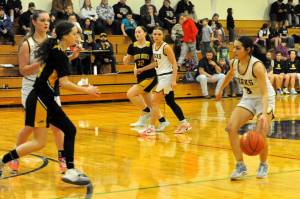 Spartan senior Skye Hestand controls the tempo against North Beach who Forks defeated 67 to 25 in the auxiliary gym Jan. 30 on senior night. Also in the action are Brooklynn Rondeau and Karee Neel. 
Photo by Lonnie Archibald