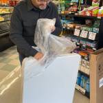It wasnt Christmas, but Jim Gossard, Forks Outfitters Store Director, opened a gift last Friday from Soroptimist International of the Olympic Rainforest…a new table for area non-profits to use when they set up at the store. SIORF Co-President Janis Flagg got the idea after using the old table during December. She shared, Id like to somehow document a thank you and recognition of them. The community owes so much to Outfitters generosity, giving everyone the ability to meet the public free of charge. 
Photos Christi Baron