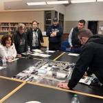 Forks Middle School Predesign Committee members reviewing the current site plan and needs of the facility.