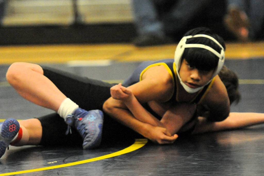 Forks Aromaldo Montealegre (top) won over his opponent Wednesday, March 18, in the Spartan Gym. 
Photos by Lonnie Archibald