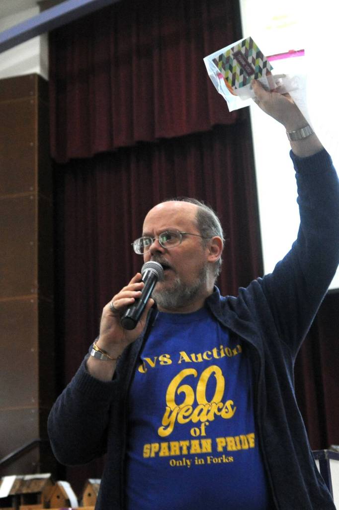 Photo Lonnie Archibald 
Rod Fleck auctions off an item on Saturday. Is it possible Rod has been at this for almost 30 years??