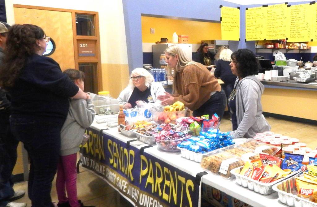 Photo Christi Baron 
Senior Parents kept the delicious aroma of food filling the building over the weekend. Helping keep the hungry bidders well fed!
