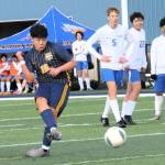 Photo by Lonnie Archibald
Rochester players were impressed by the speed of the Spartans while Spartan Ismael Hernandez (18) was getting a kick out of soccer. Forks players also got their kicks defeating Rochester 3 to 1 in jv action.