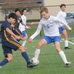 Photo by Lonnie Archibald
In jv action, Oscar Olivera controls the ball against Rochester March 25 at Spartan Stadium. Also in the action is Ismael Hernandez.