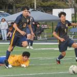 Spartans Oscar Olivera (13) and Bernabe Calmo Cartillo (9) run past the Rochester goalie in route to another Forks goal. 
Photo by Lonnie Archibald
