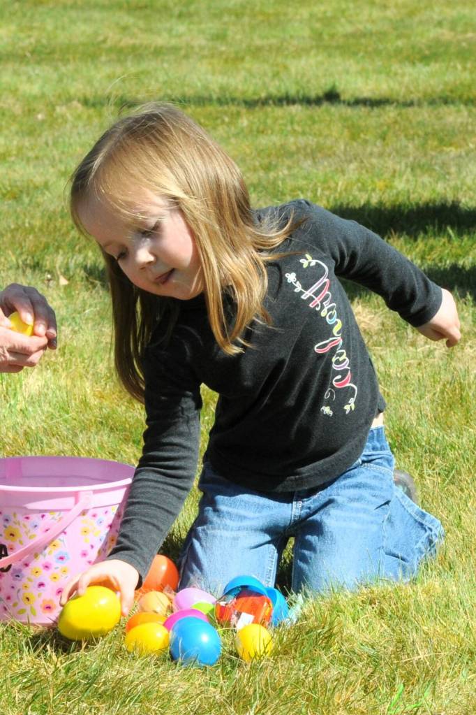 Madeline Adamire checks her eggs for prizes.