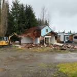 Submitted photos
Forks resident Faran Kaplan worked to improve the look of the 700 block of S. Forks Avenue recently, as he tore down an old vacant home. The building was most recently a church and, at one time, home to Edith Woodys Rags to Riches store.