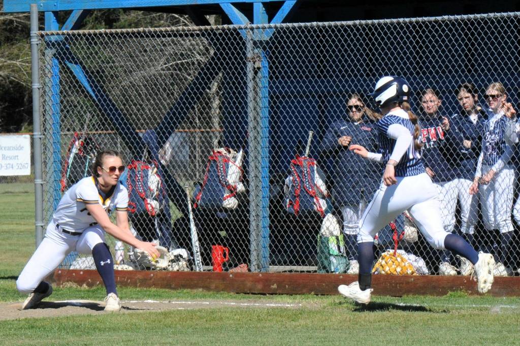 Spartan first baseman Avery Dilley makes the play at first for the out.