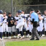 Photos by Lonnie Archibald
Spartan Fynlie Peters reaches home on her home run in the first game against the Hyaks as umpire Randy Rooney, along with Peters teammates, watch as she reaches home plate. Forks Karee Neel also hit a homerun in the second game.