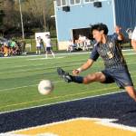 Spartan Royer Pablo was getting his kicks out of soccer on the Spartan turf under sunny skies. Looking on is Spartan Yosgart Gonzalez Ayala (15).