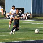 Forks forward Eduardo Calmo scores during the first half of play against Ilwaco.