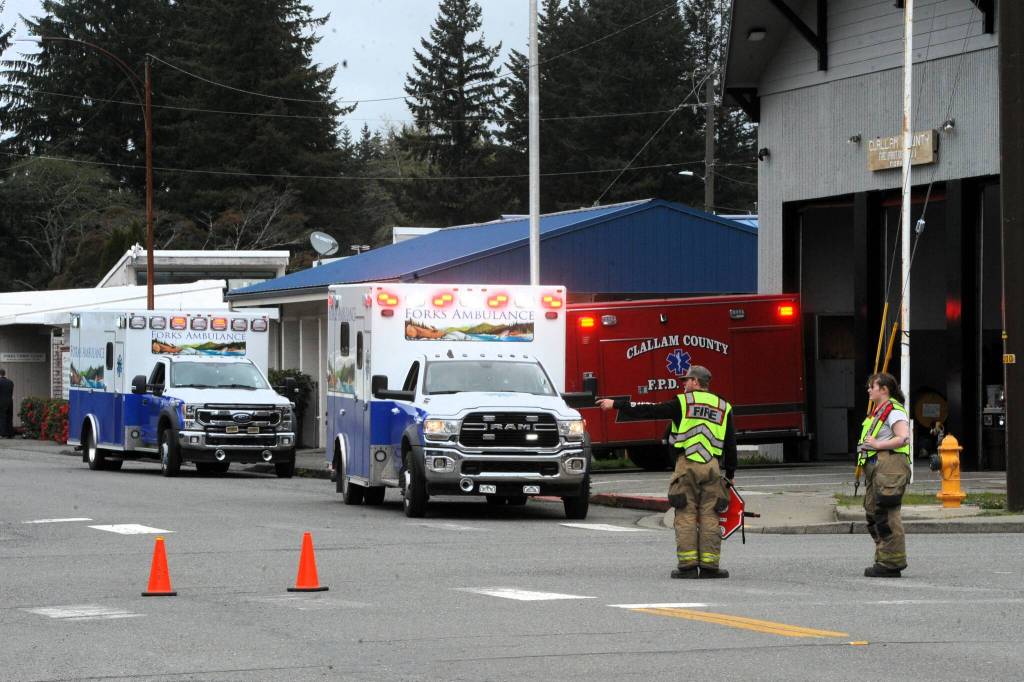 Photo by Lonnie Archibald
Forks ambulance crews stage at the Forks Fire department while Spartan Avenue is closed to traffic last Wednesday afternoon while multiple Law Enforcement agencies responded to a threat at Forks Schools.