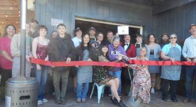 Photos Christi Baron
Owners Felicia Larson and Rachel Breed, seated center, cut the ribbon Friday evening at their new restaurant, Marble and Oak, 640 S. Forks Ave., marking the official opening with co-owner Arian Goodson and Forks Chamber Director Lissy Andros standing behind them. Friends, family, and staff gathered to celebrate as the ribbon fell, kicking off an evening of great food and drink. The project first began in March 2025.