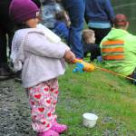 Mia Ramirez Pedro, age one, brought her favorite drink along with some colorful clothing and a fish pole to the bank of the Bogachiel Hatchery during the annual Kids Fishing Day.
