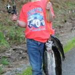 Seven year old Boone Attaway displayed his monster truck shirt along with his monster trout during this exciting day for kids here at the old fishing hole. Here at the Bogachiel Hatchery.
