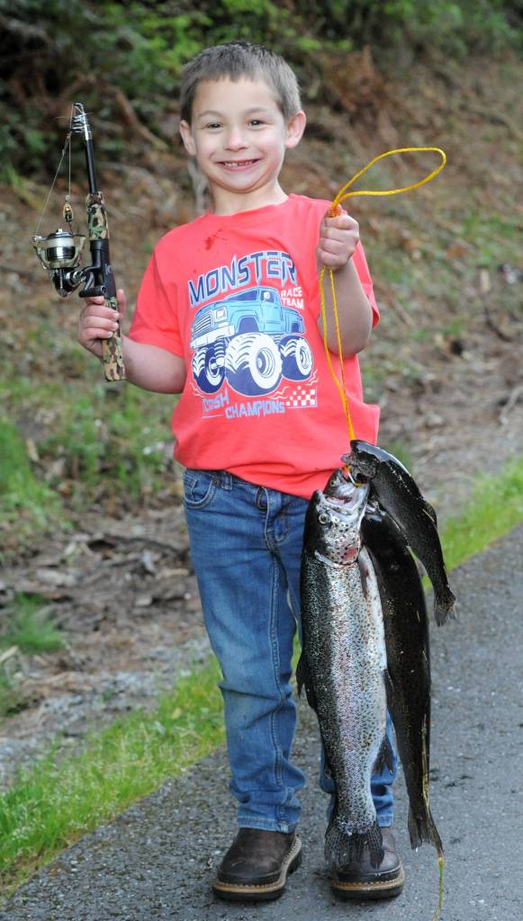 Seven year old Boone Attaway displayed his monster truck shirt along with his monster trout during this exciting day for kids here at the old fishing hole. Here at the Bogachiel Hatchery.