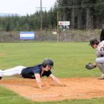 Spartan Landon Olson dives safely into third against the Ilwaco Fisherman who defeated Forks 6 to 0 and 11 to 2 in this double header in Beaver.