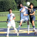 Spartan Orlando Camacho competes with Hoquiam for ball control.