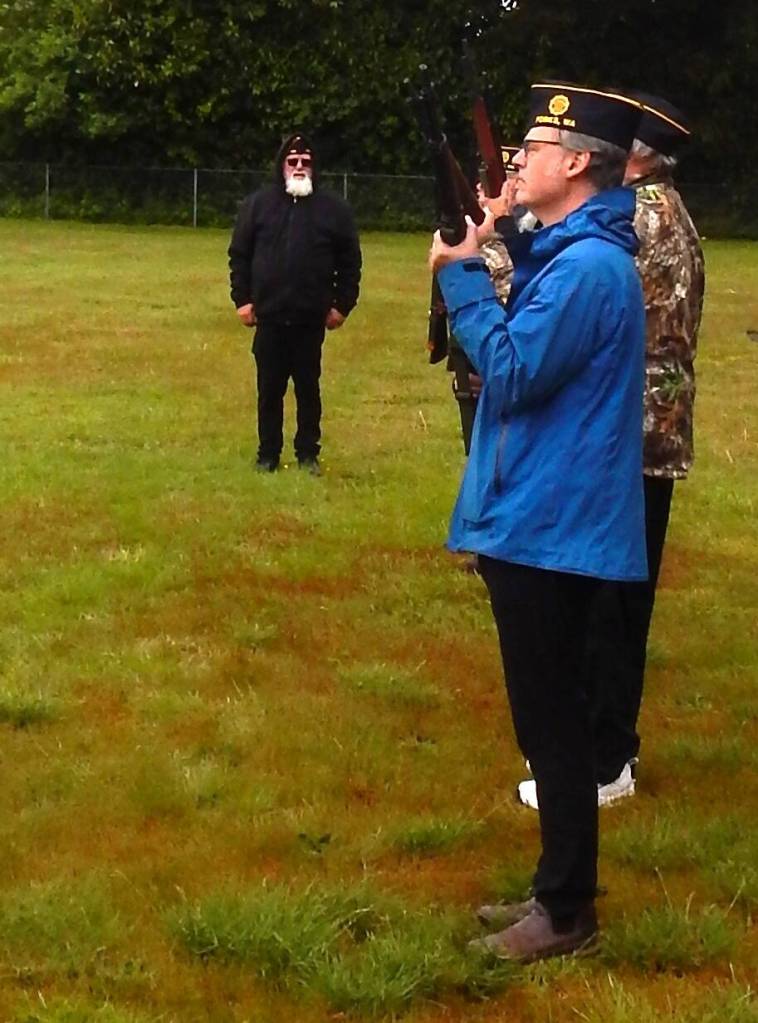 Photo Christi Baron 
American Legion Commander Bubba Bolin prepares the squad for the gun salute on Monday at the Forks Cemetery.