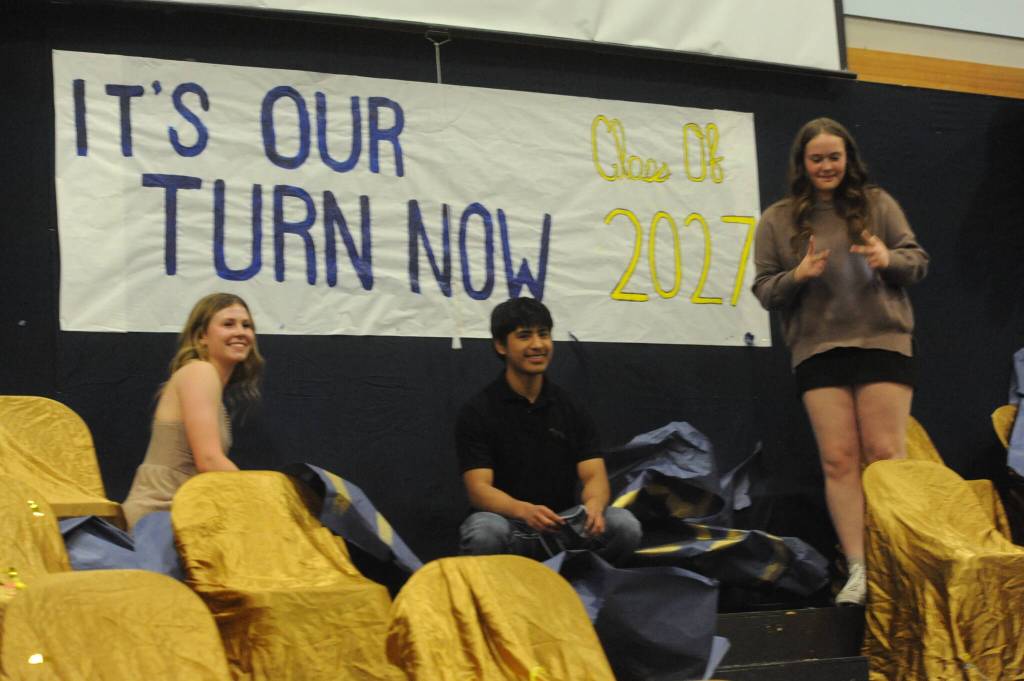 Photos by Lonnie Archibald
From left, Bailey Johnson, Samuel Lopez, and Fynlie Peters revealed the banner just below the class of 2026 sign, telling the entire Spartan world that it is now their turn. The class of 2027, that is.