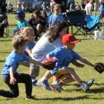Giant infielders showed good hustle as they played on a batted ball, while fans cheered for these 5 and 6-year-old athletes who came to compete in this T-Ball contest.