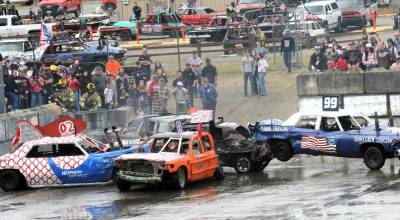 Photo by Lonnie Archibald 
The Dahlgren Logging derby car, far right, without 4-wheel drive, was temporarily out of commission. However, it did go on to win heat B at the annual Demolition Derby held Saturday at the Tillicum Park Arena.