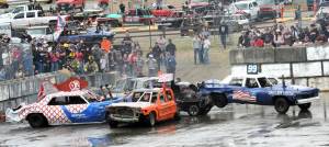 Photo by Lonnie Archibald 
The Dahlgren Logging derby car, far right, without 4-wheel drive, was temporarily out of commission. However, it did go on to win heat B at the annual Demolition Derby held Saturday at the Tillicum Park Arena.