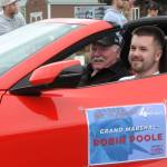 Robin Poole, in the passenger seat riding in his Corvette, was the Grand Marshal for this years Forks 4th of July Parade. Photo by Lonnie Archibald