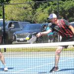 Steve Jewett hits while teammate Dave Gundel looks on during the Paddle Battle Pickleball Tournament held Sunday at Tillicum Park. The event was sponsored by West End Thunder.