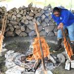 Randy Jackson Jr. baked salmon the traditional way Saturday at the Senior Center.