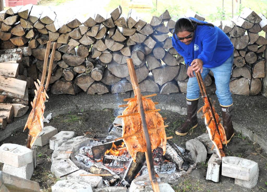 Randy Jackson Jr. baked salmon the traditional way Saturday at the Senior Center.