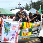 This Quileute Days canoe parade entry offered a Paddle for the Battle banner as Veterans waved to the crowd on Saturday.