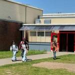 Submitted photo
Middle school students walk outdoors between four separate buildings during the school day. The proposed replacement school would improve safety and enhance learning by bringing all classrooms under one roof with a single secure entrance.