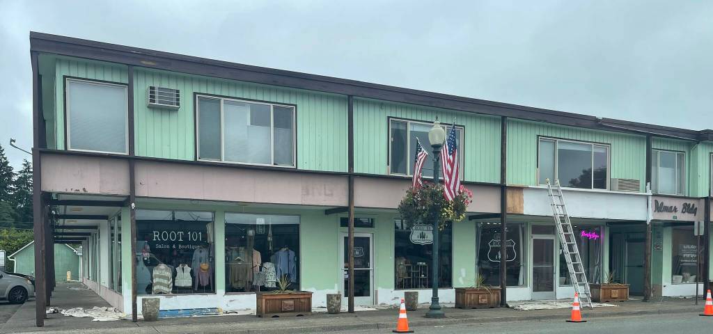 Photo Christi Baron
The mint green and brown that has been the signature color of the Almar Building for as long as many can remember is changing. On Monday morning ladders and paint cans indicated a new paint job was soon to be.