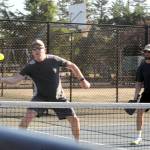 Chad Morris shows good paddle to ball contact as he and Nick Miron team up to compete in this Pickleball contest on this hot day at Tilicum Park in Forks.